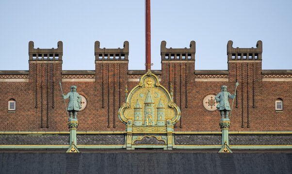 Brick fa&ccedil;ade with gilded city coat of arms, town hall in the National Romantic style by Martin Nyrop, Town Hall Square, Rathausplatz or R&aring;dhuspladsen, Copenhagen, Denmark