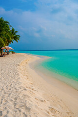 Tranquil closeup calm sea water waves with palm trees. Beautiful Panorama, Tropical island beach landscape exotic shore coast. Summer vacation, holiday amazing nature. Relax paradise, Maldives.
