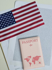Fototapeta premium Travel preparations with a passport, American flag, and travel documents