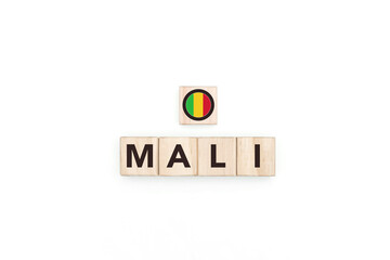 Wooden blocks bearing the name and flag of Mali. Malian and Islam Culture, national identity, travel, and geography in an advertising space design.