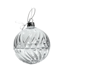 A close-up shot of a clear, ornamented sphere hanging against a black backdrop. The bauble features a detailed geometric design
