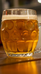 a mug of beer on the background of a tangled table top