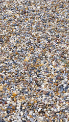 tiny colored pebbles with visible details. background or texture