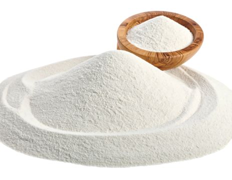 A close-up shot of a white powder mound, with a wooden bowl also filled. The composition highlights textures and subtle gradients