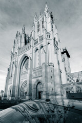 Fototapeta premium National Cathedral and a reflection over a car - Washington DC United States
