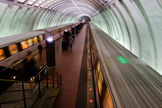 Washington D.C. - Subway station with passengers and train in motion blur	