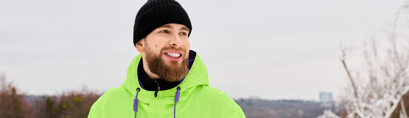 Bearded man enjoys the thrill of snowboarding on a snowy slope in winter landscape