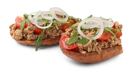 Delicious bruschettas with tuna, tomatoes, onion and arugula isolated on white