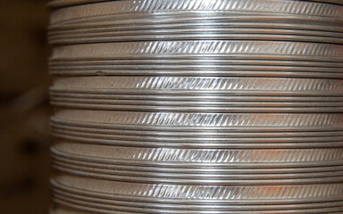 shiny currency with textured edges, bright stacked coins with reflective surfaces capturing light