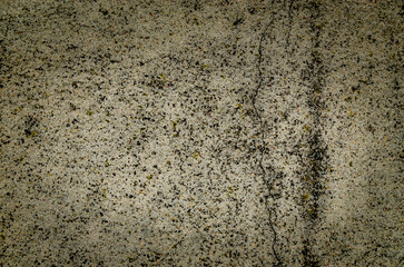 Detail of a textured surface showcasing unique patterns created by mineral deposits and natural elements, revealing a combination of earthy colors and textures. Copy space. 