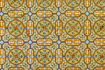 Ornamental yellow azulejo pattern close up from facade in Ovar, Portugal, Ovar – Furadouro, 9.10.2025
