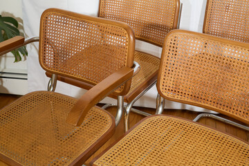 Closeup of cane seat and back on Marcel Breuer Cesca cantilever chair
