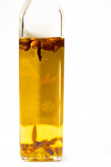 Chili-Infused Olive Oil Bottle on White Background, Gourmet Ingredient