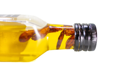 Chili-Infused Olive Oil Bottle on White Background, Gourmet Ingredient
