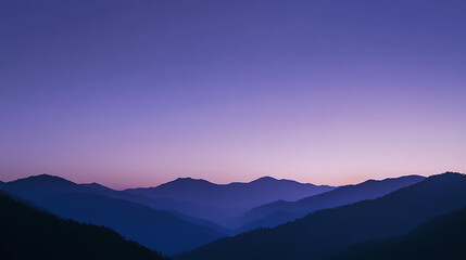 Fototapeta premium Stunning, layered mountains fade into the horizon beneath a tranquil, lilac-colored dawn sky. Distant stars hint at the vastness above, a scene of peace and serenity.