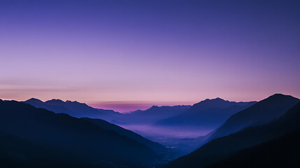 Majestic mountains rise against a vibrant, gradient sky, bathed in serene hues of pink and purple, casting deep shadows in the valley below. Nature's beauty unfolds.