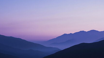 Fototapeta premium Serene mountain landscape at dusk, featuring layers of rolling hills in shades of violet and indigo under a soft, pastel-colored sky. Calming nature backdrop.
