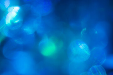 Blue bokeh effect, bright festive light photo for cover design, festive New Year background image, Christmas decoration