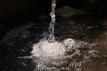 water pouring into a glass