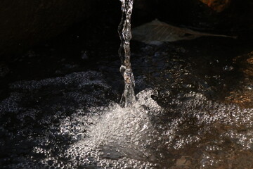 water pouring into a glass