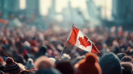 Canadian flag waving above a lively crowd at event