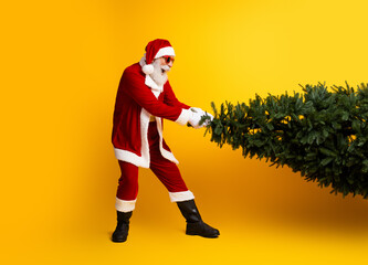 Santa Claus pulling a Christmas tree on a vibrant yellow background, evoking festive spirit and holiday joy
