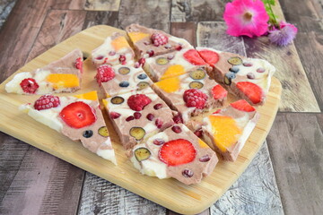 Frozen yogurt bark with strawberry, blueberry, pomegranate and orange