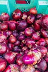 Fresh Red Onions in Green Crate for Market, Food Preparation and Cooking, Shipping Display Produce