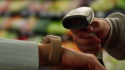 Woman Paying Bill With Watch Using Wireless Pos Terminal in shop store supermarket, Waiter Processing Payment, scan qr code with discounts, card banking. 