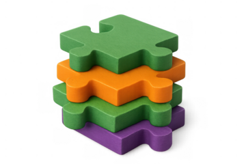 Stacked colorful puzzle pieces forming a tower, representing business concepts like solutions, integration, strategy, and collaboration