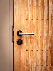 Wooden Door Close-Up with Handle and Lock