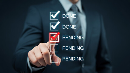 A businessman in a suit is pointing at a checklist with the words done and pending, indicating the status of tasks or projects in a business setting