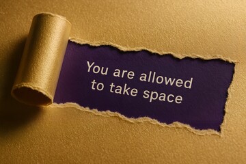 Torn Paper Quote &ldquo;You Are Allowed to Take Space&rdquo; &mdash; Empowerment Message on Gold Paper Background