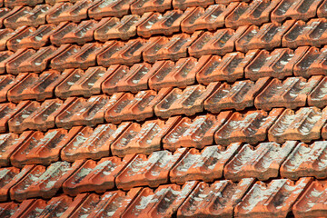 The roof of the house is covered with old red tiles