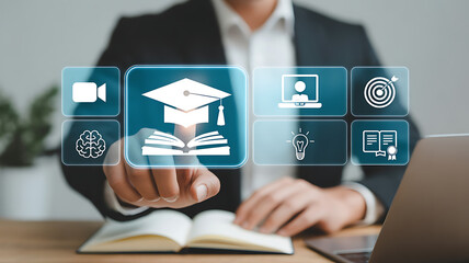 A person touching a virtual screen with education icons, including a graduation cap on a book, representing online learning and educational technology