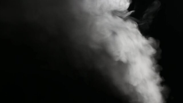 A swirling plume of white smoke against a dark black background creating an abstract atmospheric effect for artistic design - Powered by Adobe