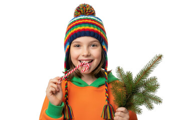 A happy young girl wearing a colorful knitted hat and holding a candy cane and pine branch, isolated on transparent background