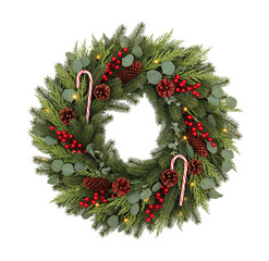 Christmas wreath with cone, eucalyptus branches and red berries. Decor elements for New Year and Christmas design