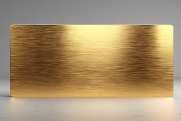 Horyzontalna płyta ze szczotkowanego złota lub mosiądzu, z zaokrąglonymi rogami, z wyraźną fakturą poziomych linii, na neutralnym tle.