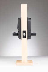 Modern beige and black electronic device on stand