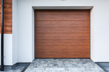Designer entrance door to a country house. Modern design. Luxurious exterior. Facade of a modern building with modern doors.
