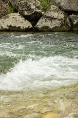 Scenic Mountain Stream with Clear Water and Rocky Banks