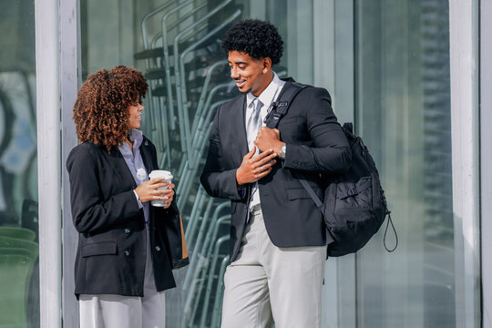 business woman and man chatting and talking during coffee break