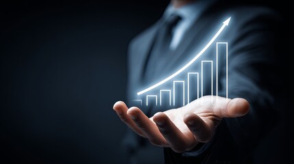 Businessman Holding a Hand with a Growing Graph and Trend Lines Against a Dark Background, Symbolizing Financial Success and Growth in the Economy