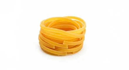 Coil of uncooked, golden tagliatelle pasta, isolated on a clean white background