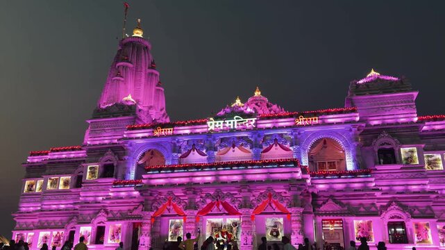 Prem Mandir temple illuminated in stunning shades of pink and purple at night, capturing the divine atmosphere of Vrindavan&rsquo;s sacred landmark. The architectural brilliance and vibrant lighting showcas