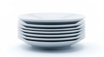 Stack of nine white shallow bowls, all identical, on a bright, clean background