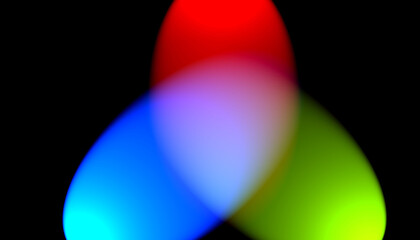 Abstract overlapping blurred lights in red blue and green against a dark black background.