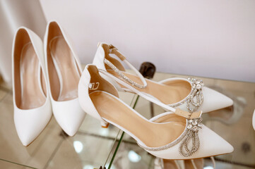 White high-heeled shoes. Elegant and stylish wedding shoes.