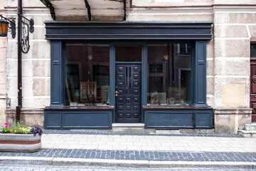 Designer entrance door to a country house. Modern design. Luxurious exterior. Facade of a modern building with modern doors.